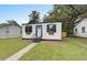 Charming home with a black and white exterior, black shutters, and window boxes at 2317 Kent Ave, North Charleston, SC 29405
