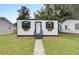 A charming home with a black and white exterior and flower boxes in front of the windows at 2317 Kent Ave, North Charleston, SC 29405