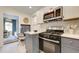 Open kitchen featuring stainless steel appliances, a gas range, and stylish gray and white cabinetry at 2317 Kent Ave, North Charleston, SC 29405