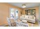 Charming living room featuring a coastal design, complemented by a stylish sofa and chairs at 2317 Kent Ave, North Charleston, SC 29405