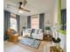 Light and airy living room featuring a ceiling fan, stylish decor, and natural light at 2317 Kent Ave, North Charleston, SC 29405