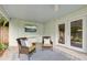 Inviting outdoor porch with comfortable seating, television, and outdoor access at 2317 Kent Ave, North Charleston, SC 29405