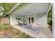 Inviting outdoor porch with comfortable seating, hanging swings, and an outdoor TV at 2317 Kent Ave, North Charleston, SC 29405