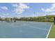 Well-maintained blue basketball court with hoops and seating areas, perfect for recreational games and community events at 2516 Willbrook Ln, Mount Pleasant, SC 29466