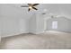 Spacious carpeted bedroom with neutral walls, ceiling fans and natural light at 2516 Willbrook Ln, Mount Pleasant, SC 29466