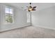 Neutral bedroom has neutral paint and carpeting, crown molding, and two large windows at 2516 Willbrook Ln, Mount Pleasant, SC 29466