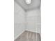 A corner walk-in closet with multiple wire shelves and neutral carpeting at 2516 Willbrook Ln, Mount Pleasant, SC 29466