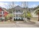 Charming two-story home boasts double porches, manicured landscaping, and inviting curb appeal at 2516 Willbrook Ln, Mount Pleasant, SC 29466