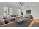 Inviting living room with a ceiling fan, hardwood floors, and large windows at 2516 Willbrook Ln, Mount Pleasant, SC 29466