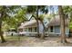 Spacious backyard features a serene deck and blue siding with large windows, perfect for enjoying outdoor living at 2653 Seabrook Island Rd, Seabrook Island, SC 29455