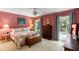Comfortable bedroom featuring a cozy quilt, wood chest, and natural light streaming through the windows at 2653 Seabrook Island Rd, Seabrook Island, SC 29455
