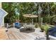 Outdoor deck area with patio furniture, lounge chair, and beautiful natural surroundings at 2653 Seabrook Island Rd, Seabrook Island, SC 29455