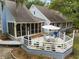 Expansive deck, accessible by ramp, offers ample space for dining and relaxation, complemented by the home's serene setting at 2653 Seabrook Island Rd, Seabrook Island, SC 29455