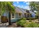 Pleasant home exterior with neat landscaping, blue siding, and large windows adding to the curb appeal at 2653 Seabrook Island Rd, Seabrook Island, SC 29455
