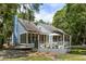 Charming home with a screened porch, spacious deck, and lush, green backyard at 2653 Seabrook Island Rd, Seabrook Island, SC 29455