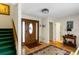 Traditional foyer featuring hardwood floors, a decorative rug, and a wooden front door at 2653 Seabrook Island Rd, Seabrook Island, SC 29455