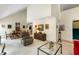 Well-lit living space boasts a vaulted ceiling, an adjacent dining area, and bright walls for displaying art at 2653 Seabrook Island Rd, Seabrook Island, SC 29455