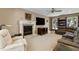 Comfortable living room with a fireplace, large TV, and neutral tones at 2653 Seabrook Island Rd, Seabrook Island, SC 29455