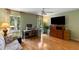 Bright office space with hardwood floors, built-in shelving, and ample natural light at 2653 Seabrook Island Rd, Seabrook Island, SC 29455