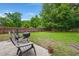 Spacious backyard featuring a well-kept lawn with established trees at 2845 August Rd, Johns Island, SC 29455