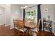 Traditional dining room with hardwood floors, natural light, and seating for six at 2845 August Rd, Johns Island, SC 29455