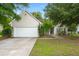 Charming single-Gathering home featuring a two-car garage and mature landscaping at 2845 August Rd, Johns Island, SC 29455