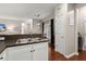 Kitchen with a double sink, dark countertops, white cabinets, and natural light at 2845 August Rd, Johns Island, SC 29455