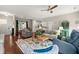 Open-concept living area flowing into dining and kitchen space with hardwood floors at 2845 August Rd, Johns Island, SC 29455