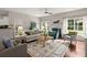 Cozy living room with fireplace, French doors, and a comfortable seating arrangement at 2845 August Rd, Johns Island, SC 29455
