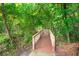 Wood walkway surrounded by lush greenery and trees, creating a peaceful natural setting at 2845 August Rd, Johns Island, SC 29455