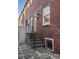Home's backyard features a stairway, a brick exterior, and beautiful landscaping at 301 Broad St # 1, Charleston, SC 29401