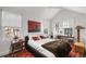 Sunlit bedroom features vaulted ceiling, neutral paint, and a plush brown blanket accenting the bed at 301 Broad St # 1, Charleston, SC 29401