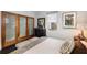 Serene bedroom featuring modern decor, natural light, and closet with sliding doors at 301 Broad St # 1, Charleston, SC 29401