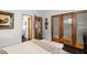 Tranquil bedroom with closet, neutral color scheme, and a view of the bathroom at 301 Broad St # 1, Charleston, SC 29401