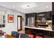 Modern kitchen with sleek black cabinets, granite countertops, stainless steel appliances, and bright lighting at 301 Broad St # 1, Charleston, SC 29401