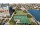Aerial view showcasing tennis courts and green space near a brick building at 301 Broad St # 1, Charleston, SC 29401