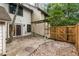 Backyard patio area with stone floor, wood pergola, wood fence and privacy gate at 321 Lapwing Ln, Mount Pleasant, SC 29464