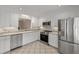 Updated kitchen with white cabinets and stainless steel appliances at 321 Lapwing Ln, Mount Pleasant, SC 29464