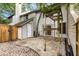 Backyard stone patio area with wooden pergola, wood fence, and storage area at 321 Lapwing Ln, Mount Pleasant, SC 29464