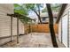 Backyard patio area with stone floor, wood pergola, and privacy fence at 321 Lapwing Ln, Mount Pleasant, SC 29464