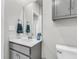 Bathroom featuring gray vanity, a mirror and towel rack, and a toilet at 348 Spindlewood Way, Charleston, SC 29414