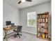 Bedroom with a ceiling fan, a window with blinds, desk, chair and a bookshelf at 348 Spindlewood Way, Charleston, SC 29414