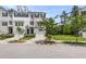 Inviting townhome with a garage, neat landscaping, and a classic design, offering a great curb appeal at 348 Spindlewood Way, Charleston, SC 29414