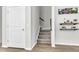 Foyer features a stairway, vinyl floors, and a door adjacent to decor and floating shelves at 348 Spindlewood Way, Charleston, SC 29414
