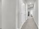 Hallway with gray walls and carpet, white doors, and an overhead skylight at 348 Spindlewood Way, Charleston, SC 29414