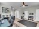 Spacious home gym featuring exercise equipment, a ceiling fan, and ample storage space at 348 Spindlewood Way, Charleston, SC 29414