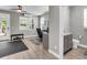 Home office area with a desk, access to the backyard, and a nearby half bathroom at 348 Spindlewood Way, Charleston, SC 29414