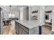 Modern kitchen island with white countertop and gray cabinets at 348 Spindlewood Way, Charleston, SC 29414