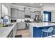 Modern kitchen with gray cabinets, stainless steel appliances, quartz countertops, and a stylish island at 348 Spindlewood Way, Charleston, SC 29414