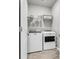 Convenient laundry area featuring modern washer and dryer, wire shelving, and ample storage space at 348 Spindlewood Way, Charleston, SC 29414